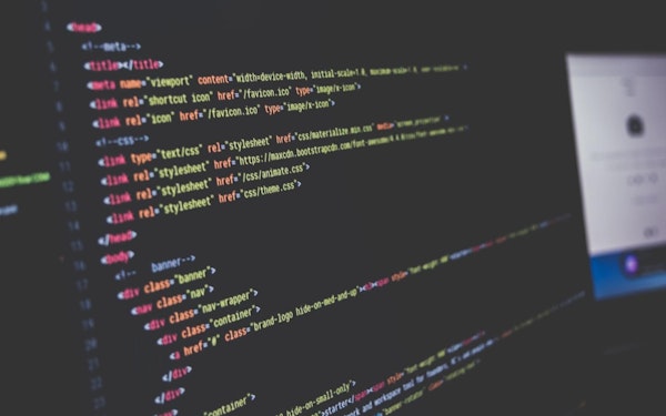 A computer screen displays lines of code.