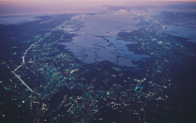 An aerial view of a city during sunset